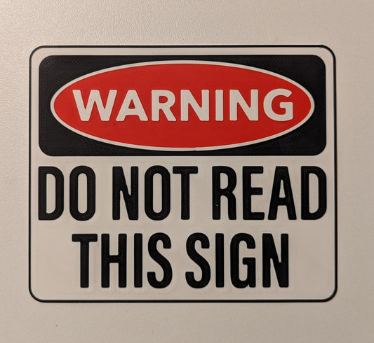 Türschild "WARNING - DO NOT READ THIS SIGN"